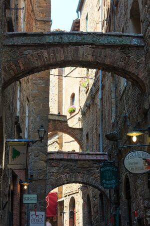 VOLTERRA, ITALY - JUNE 24, 2017: Summer ancient walled mountaintop town Volterra street scene, Pisa province, Tuscany, Italy.のeditorial素材
