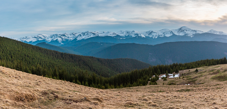 Spring Carpathian mountains landscape with snow-covered tops of Chornohora ridge in far, Ukraine.の写真素材