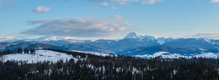 Evening twilight winter cloudy day snow covered alp mountain ridge (Ukraine, Carpathian Mountains,...