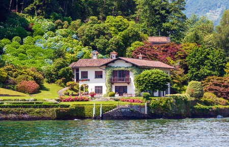 Lake Como, Italy - June 15, 2012: Summer lake shore view from ship board.のeditorial素材