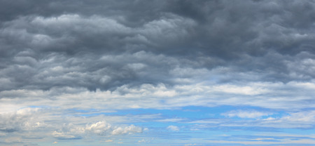 Summer weather changing overcast sky background. Overcast rainy clouds over blue azure sky.