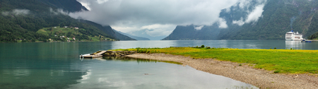 Lustrafjorden fjord and mountains summer cloudy landscape, Norway. Panorama.の写真素材