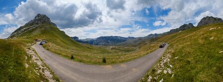 Picturesque summer mountain landscape of Durmitor National Park, Montenegro, Europe, Balkans Dinaric Alps, UNESCO World Heritage. Durmitor panoramic road, Sedlo pass. Cars unrecognizable.の写真素材