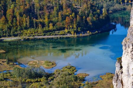 View from up to peaceful mountain lake with clear transparent water and reflections.  Almsee lake, Upper Austria.の写真素材