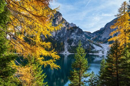 Autumn peaceful alpine lake Braies or Pragser Wildsee. Fanes-Sennes-Prags national park, South Tyrol, Dolomites Alps, Italy, Europe. Picturesque traveling, seasonal and nature beauty concept scene.の写真素材