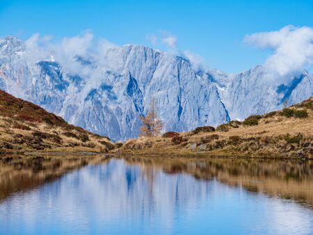 Autumn alpine Kleiner Paarsee or Paarseen lake, Dorfgastein, Land Salzburg, Austria. Alps Hochkonig...