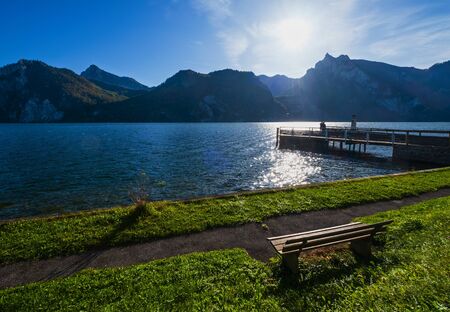 Peaceful autumn Alps mountain lake. Morning view to Traunsee lake and Traunstein mountain in far,...