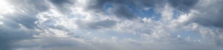 Fluffy clouds in the overcast sky view. Climate, environment and weather concept sky background.