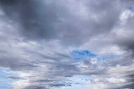 Fluffy clouds in the overcast sky view. Climate, environment and weather concept sky background.