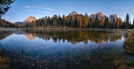 Beautiful autumn evening Lake Antorno and Three Peaks of Lavaredo (Lago Di Antorno and Tre Cime di Lavaredo), Dolomites, Italy. Picturesque traveling, seasonal and nature beauty concept scene.の写真素材