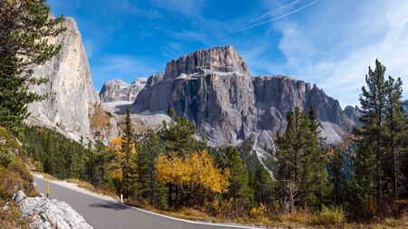 Autumn alpine Dolomites mountain scene, Sudtirol, Italy. Peaceful view near Sella Pass. Picturesque...