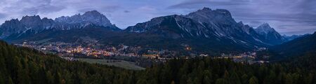 Autumn night Cortina d'Ampezzo alpine Dolomites mountain town, Belluno, Italy. Picturesque traveling and countryside beauty concept scene.の写真素材