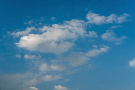 White clouds in blue azure sky. Summer good weather background.の写真素材