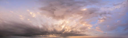 Fluffy clouds in evening overcast sky panoramic view. Climate, environment and weather concept sky...