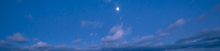 Clouds and full Moon in twilight sky view. Panoramic night sky background.の写真素材