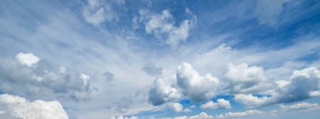 Blue sky with clouds, wide cloudscape background panorama