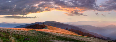 Autumn misty sunset mountain panorama (Carpathian Mt's, Ukraine). Four shots stitch image.の写真素材
