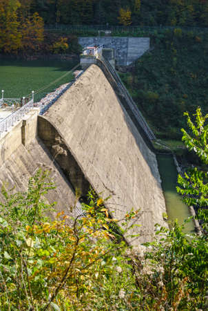 Water dam on Vilshany reservoir on the Tereblya river, Tereble-Ritska HPP, Transcarpathia, Ukraine. Beautiful autumn day in Carpathian Mountains.の写真素材