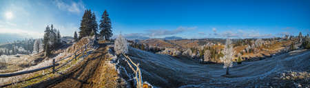 Winter coming. Last days of autumn, morning in mountain countryside peaceful picturesque hoarfrosted...