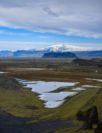 Picturesque autumn evening view to highlands and plain not far from ocean shore  from Dyrholaey Cape Viewpoint, Vik, South Iceland.の写真素材