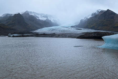 Glacier tongue slides from the VatnajÃ¶kull icecap or Vatna Glacier near subglacial...