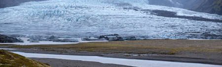 Glacier tongue slides from the VatnajÃ¶kull icecap or Vatna Glacier near subglacial...