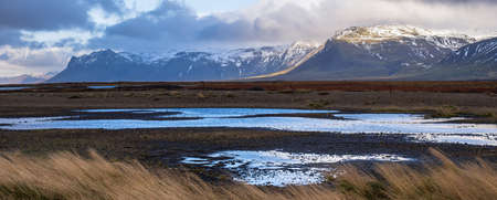 View during auto trip in West Iceland highlands, Snaefellsnes peninsula, Snaefellsjokull National Park. Spectacular volcanic tundra landscape with mountains, craters, lakes, gravel roads.の写真素材
