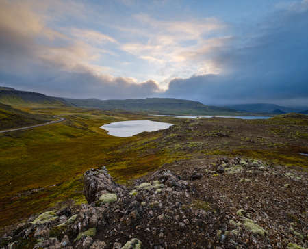 View during auto trip in West Iceland highlands, Snaefellsnes peninsula, Snaefellsjokull National Park. Spectacular volcanic tundra landscape with mountains, craters, lakes, gravel roads.の写真素材