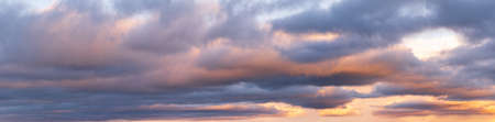 Clouds in evening dusk sky panoramic view. Climate, environment and weather concept sky background.
