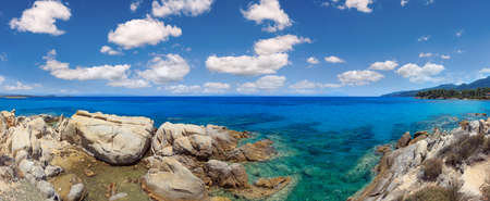 Aegean sea coast panorama and Karidi or Karydi beach (Chalkidiki, Greece). People are unrecognizable.の写真素材