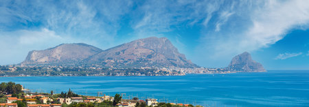 Azure Tyrrhenian sea bay and Rock of Capo Zafferano view from coastline highway road E90, Palermo region, Sicily, Italy. Four shots stitch high-resolution panorama.の写真素材
