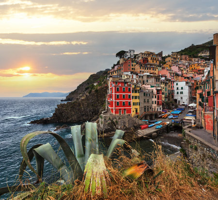 Beautiful summer Manarola - one of five famous villages of Cinque Terre National Park in Liguria, Italy, suspended between sea and land on sheer cliffs. People unrecognizable.の写真素材