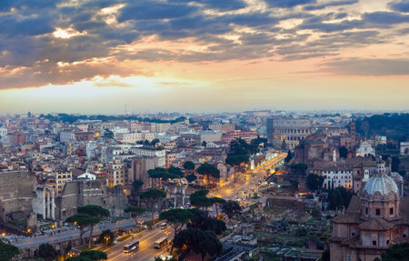 Ruins of Roman Forum. Rome City evening view from II Vittoriano top. People are unrecognizable.の写真素材