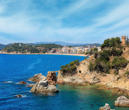Summer sea rocky coast view with Castle of Sant Joan (Sa Caleta beach,  Lloret de Mar town, Catalonia, Spain). Peoples unrecognizable.の写真素材