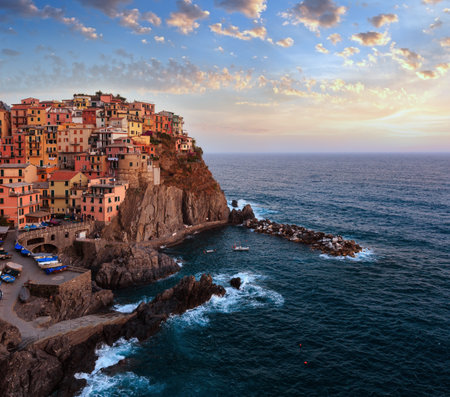 Beautiful summer Manarola - one of five famous villages of Cinque Terre National Park in Liguria, Italy, suspended between Ligurian sea and land on sheer cliffs. People unrecognizable.の写真素材