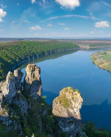 Amazing spring view on the Dnister River Canyon with picturesque rocks, fields, flowers. This place named Shyshkovi Gorby,  Nahoriany, Chernivtsi region, Ukraine.の写真素材