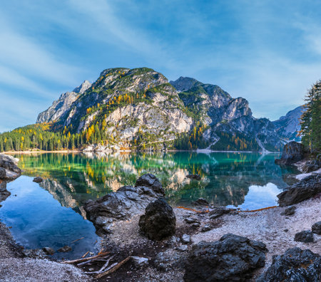 Autumn peaceful alpine lake Braies or Pragser Wildsee. Fanes-Sennes-Prags national park, South Tyrol, Dolomites Alps, Italy, Europe. Picturesque traveling, seasonal and nature beauty concept scene.の写真素材