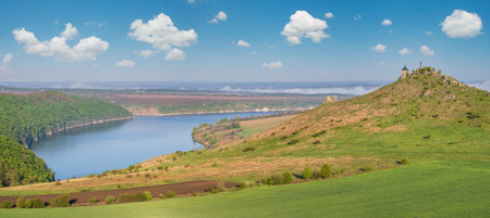 Ukraine without russian aggression. Amazing spring view on the Dnister River Canyon with picturesque rocks, fields, flowers. This place named Shyshkovi Gorby,  Nahoriany, Chernivtsi region, Ukraine.の写真素材