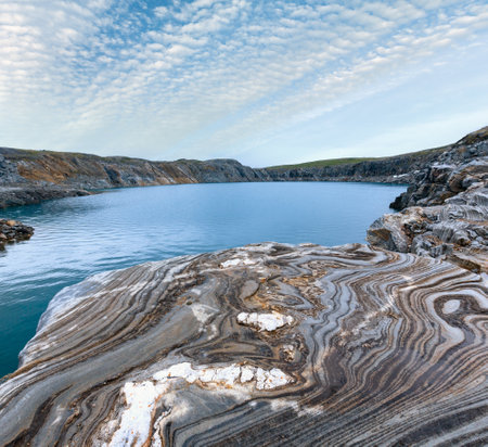 Striped stone near reservoir Storglomvatnet lake (Meloy, Norge)の写真素材