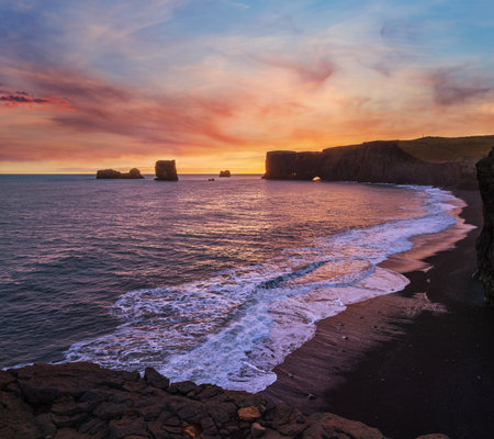 Picturesque autumn evening view Dyrholaey Cape, beach and  rock formations. Vik, South Iceland.の写真素材