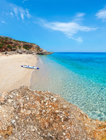 Drymades beach view, Albania. Summer Ionian sea coast view with inflatable canoe on shore.の写真素材