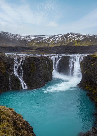 Picturesque waterfall Sigoldufoss autumn view. Season changing in southern Highlands of Iceland.の写真素材