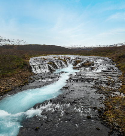 Picturesque waterfall Bruarfoss autumn view. Season changing in southern Highlands of Iceland.の写真素材