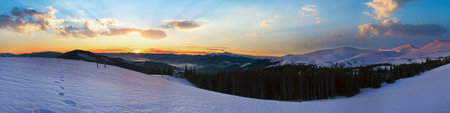 Mountain ridge sunrise panorama view with moon and sun (Drahobrat Ski Resort, Yasenja villadge, Zacarpatsjka Region, Carpathian Mt's, Ukraine).の写真素材