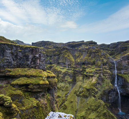 Beautiful autumn Mulagljufur Canyon, Iceland. It is located not far from Ring Road and Fjallsarlon glacier with Breidarlon ice lagoon at the south end of Vatnajokull icecap and Oaefajokull volcano.の写真素材
