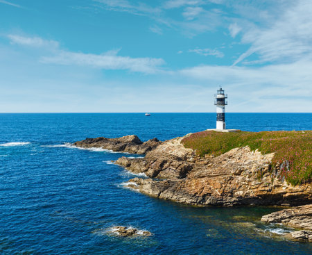 Summer ocean island Pancha coastline landscape with lighthouse (Spain).の写真素材