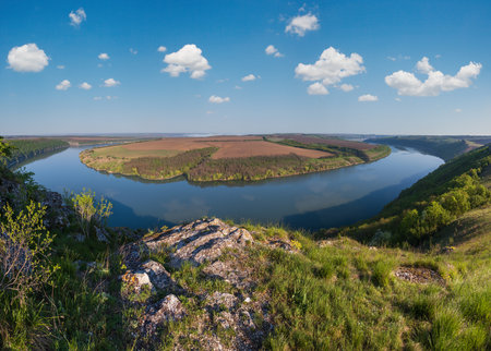 Amazing spring view on the Dnister River Canyon with picturesque rocks, fields, flowers. This place named Shyshkovi Gorby,  Nahoriany, Chernivtsi region, Ukraine.の写真素材