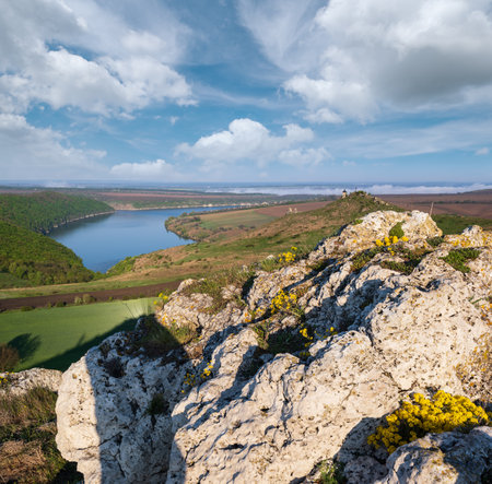 Ukraine without russian aggression. Amazing spring view on the Dnister River Canyon with picturesque rocks, fields, flowers. This place named Shyshkovi Gorby,  Nahoriany, Chernivtsi region, Ukraine.の写真素材