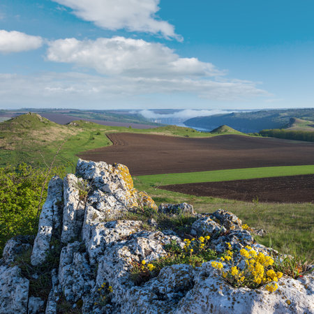Amazing spring view on the Dnister River Canyon with picturesque rocks, fields, flowers. This place named Shyshkovi Gorby,  Nahoriany, Chernivtsi region, Ukraine.の写真素材