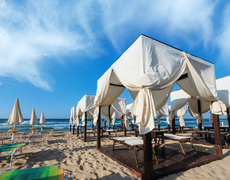 Luxury beach tents canopies on morning paradise white sandy beach Maldives of Salento (Pescoluse, Salento, Puglia, south Italy). The most beautiful sea sandy beach of Apulia.の写真素材